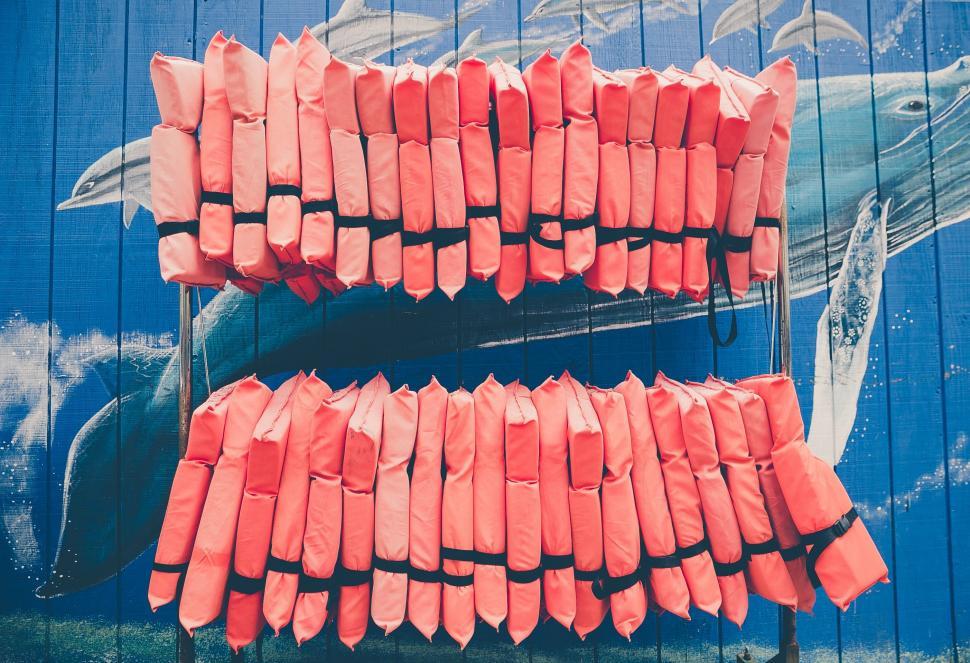Free Image of Orange Sticks Resting on Chair 