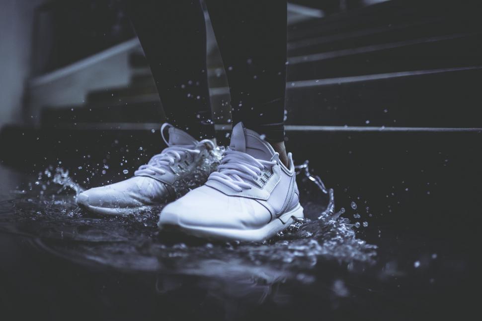 Free Image of Person Standing in Water With Feet Raised 