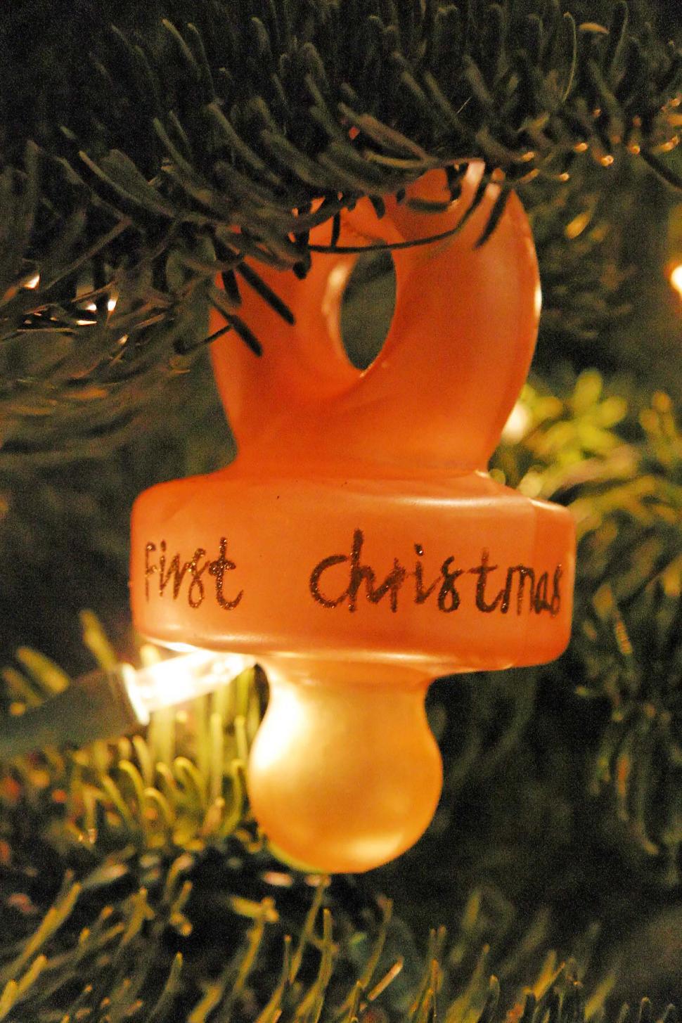 Free Image of Christmas Ornament Hanging From a Christmas Tree 
