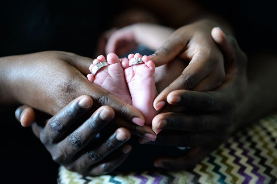 Free Image of Person Holding a Baby Close Up 