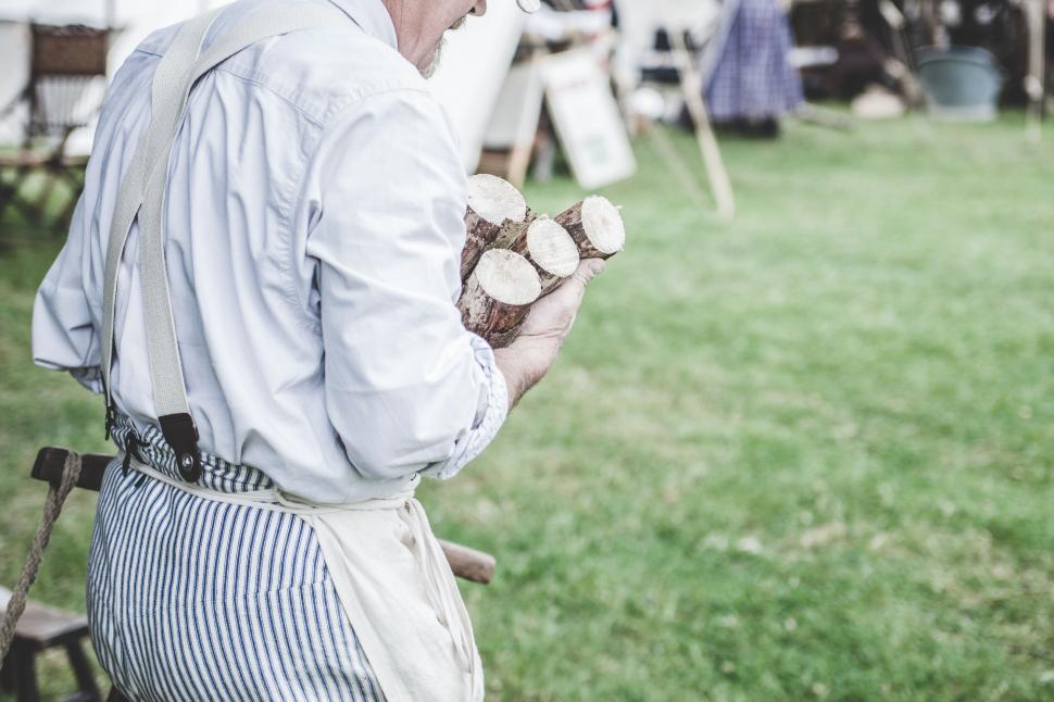 Free Image of Man Holding Piece of Wood 