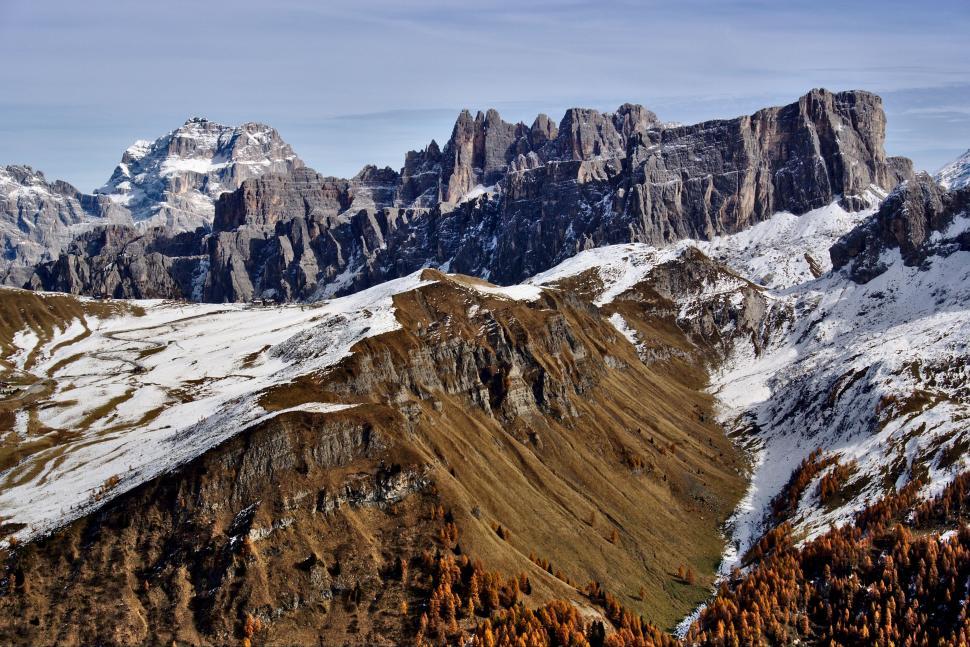 Free Image of Majestic Snow-Covered Mountain Range With Trees 