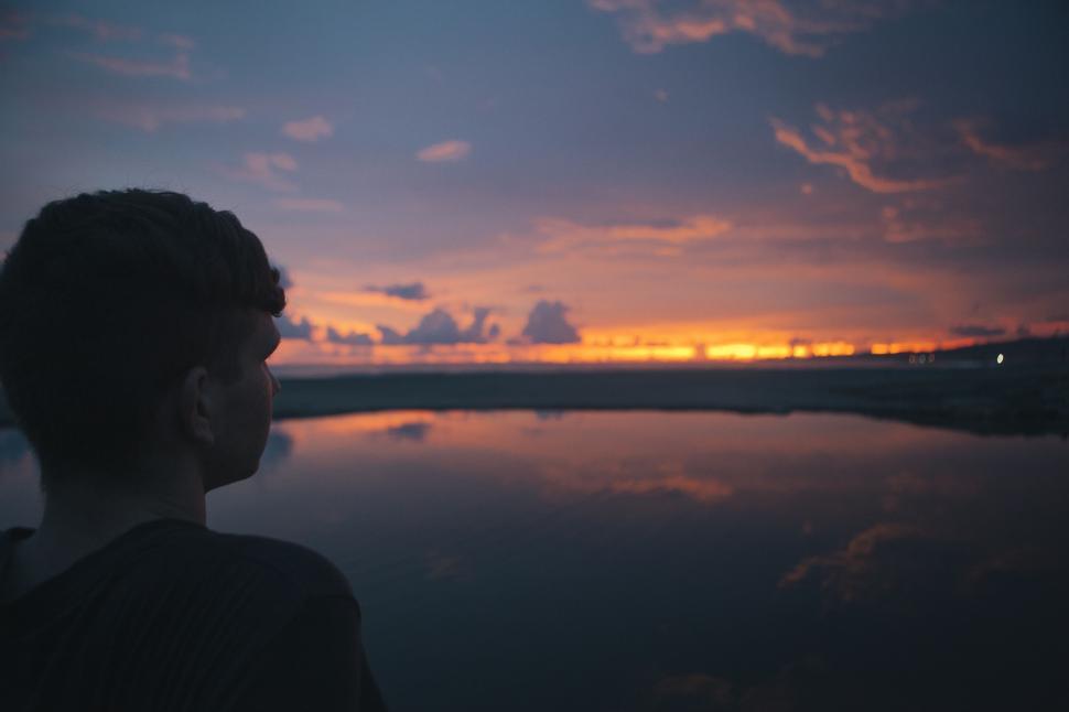 Free Image of Person Standing by Body of Water 