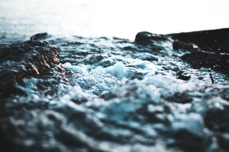 Free Image of Water Flowing Over Rocks in Black and White 