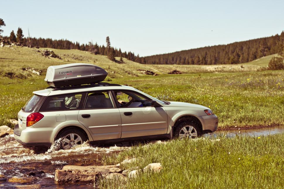 Free Image of Car Driving Through a Small Stream 