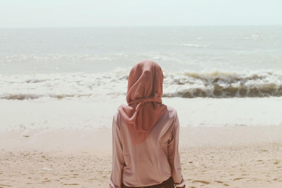 Free Image of Person Standing on Beach Near Ocean 