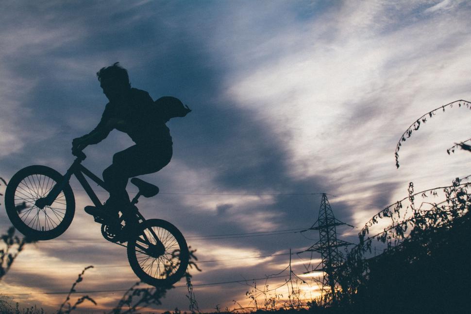 Free Image of Man Riding Bike Up Hill 