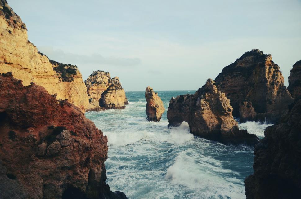 Free Image of Waves Crashing Against Rocky Coast 