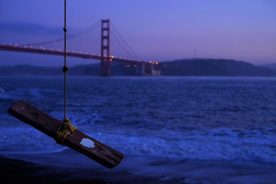Free Image of Suspended Wood Piece Near Water 