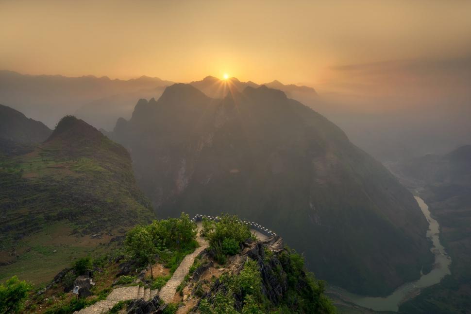 Free Image of Sun Setting Over Mountain Range 