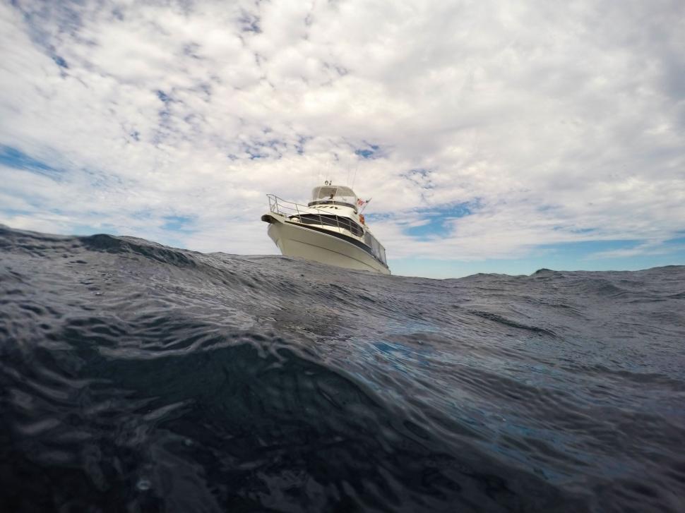 Free Image of White Boat in the Middle of the Ocean 