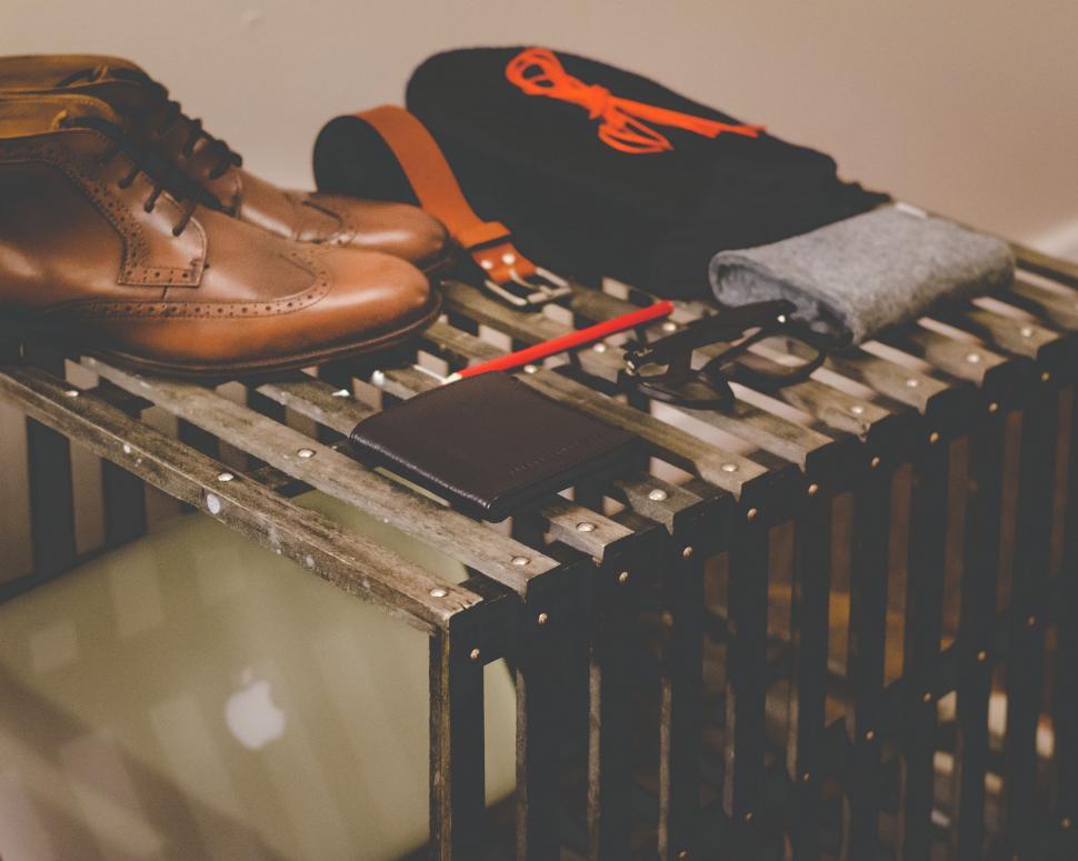 Free Image of Pair of Brown Shoes on Metal Rack 