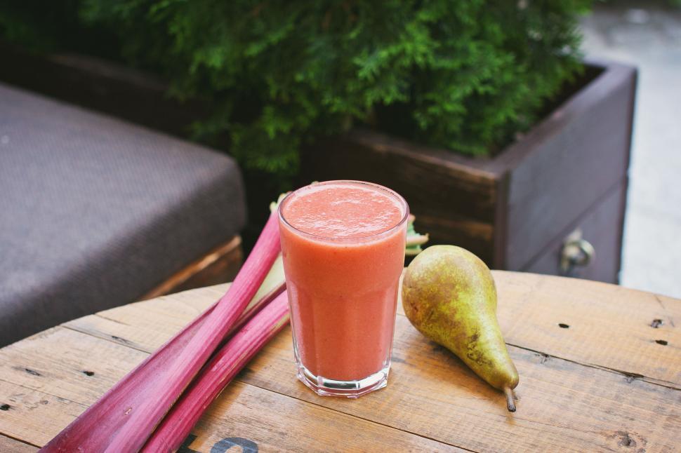 Free Image of Glass of Juice on Wooden Table 