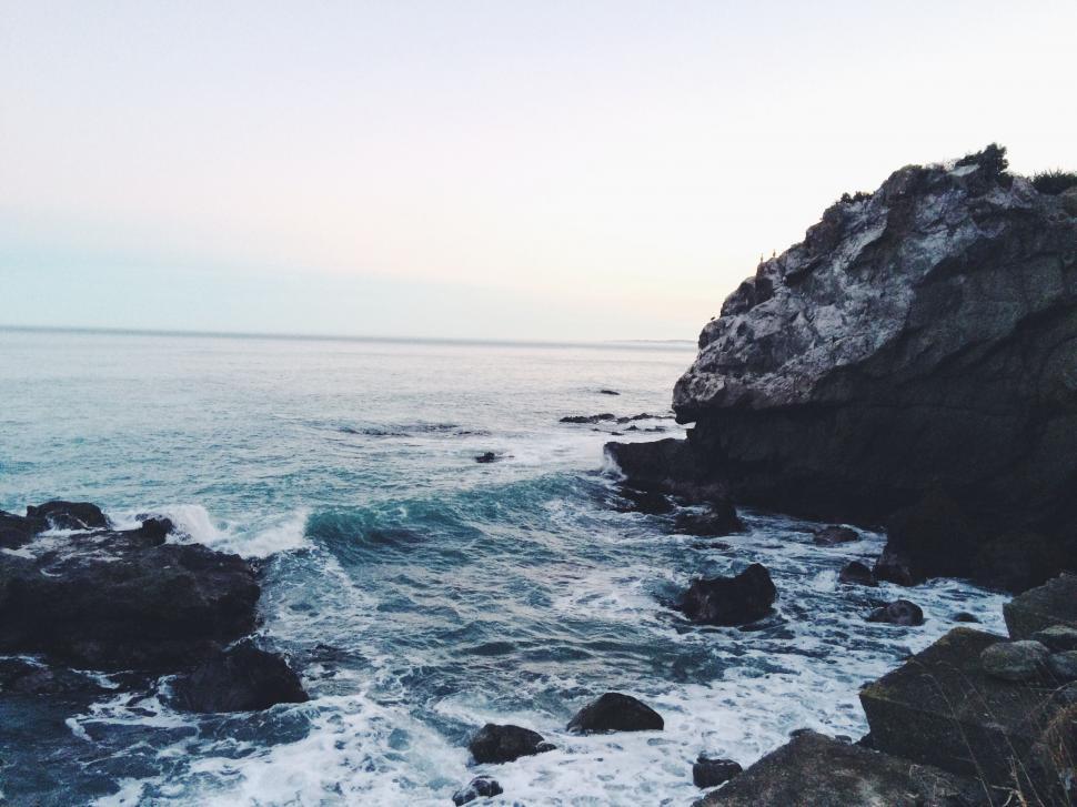 Free Image of Ocean Waves Crashing Against Rocks 