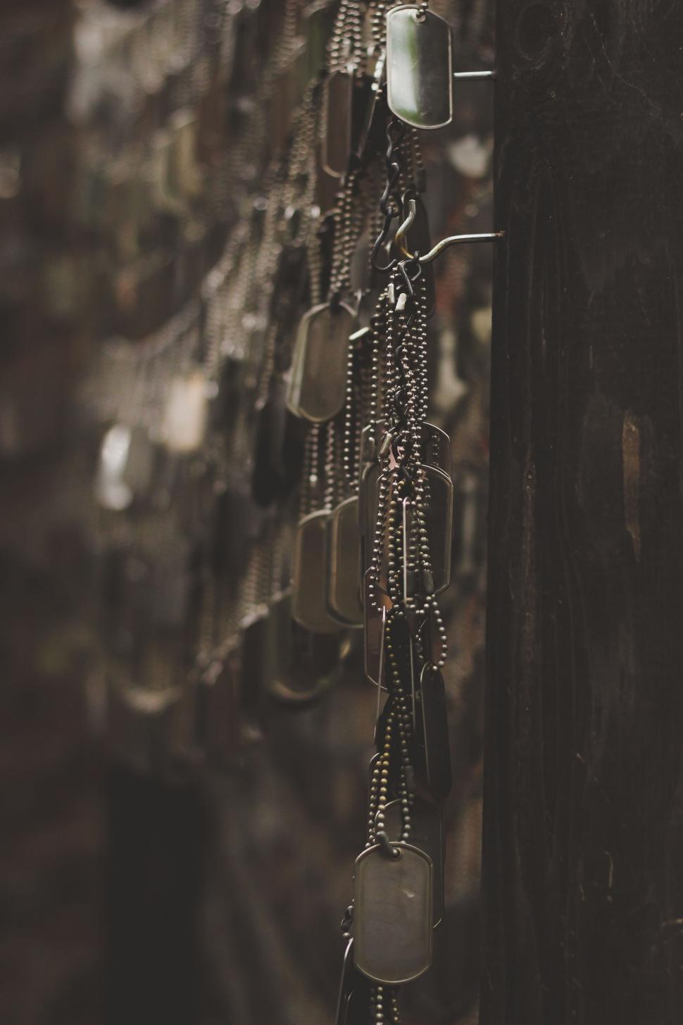 Free Image of Chain Hanging From Telephone Pole 