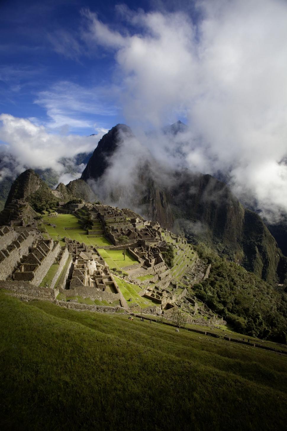 Free Image of Majestic Mountain With Clouds Rolling Over 