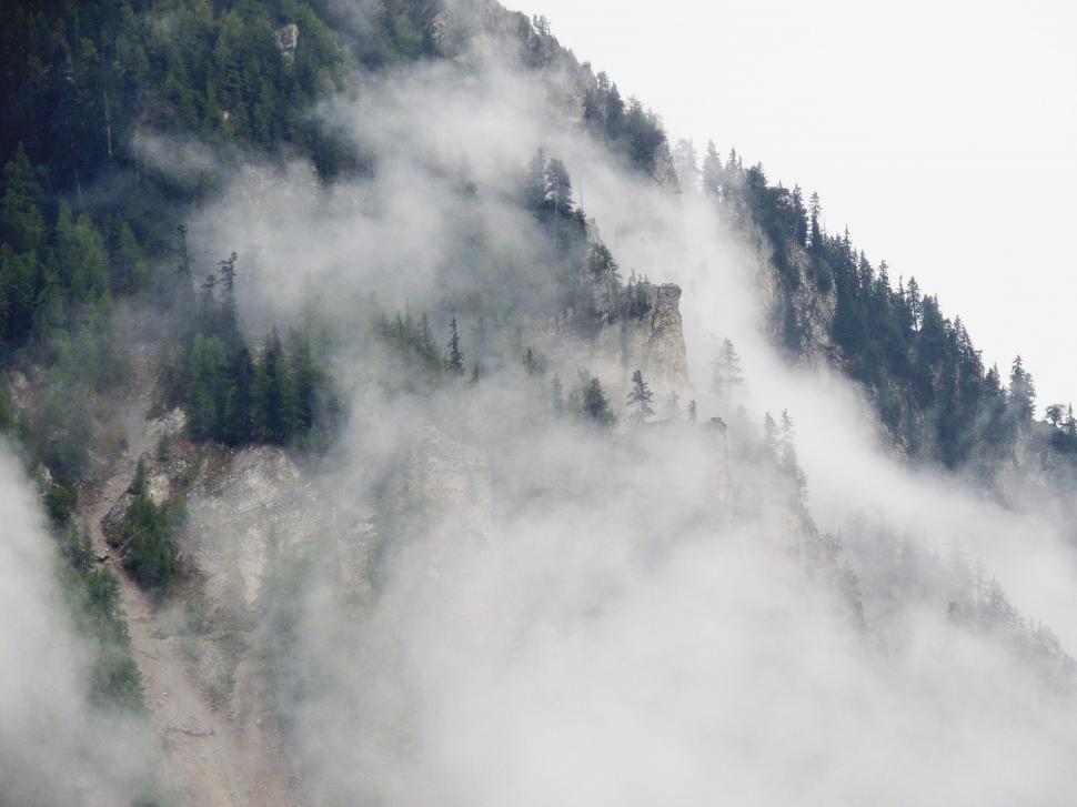 Free Image of Mountain Covered in Fog 