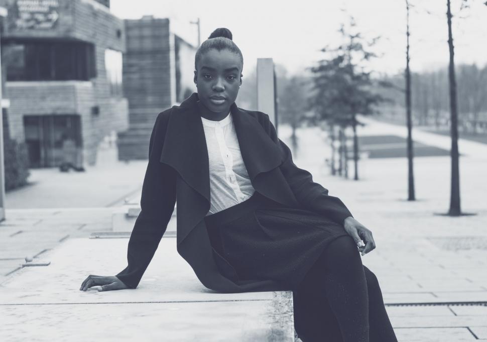 Free Image of Woman Sitting on Bench 