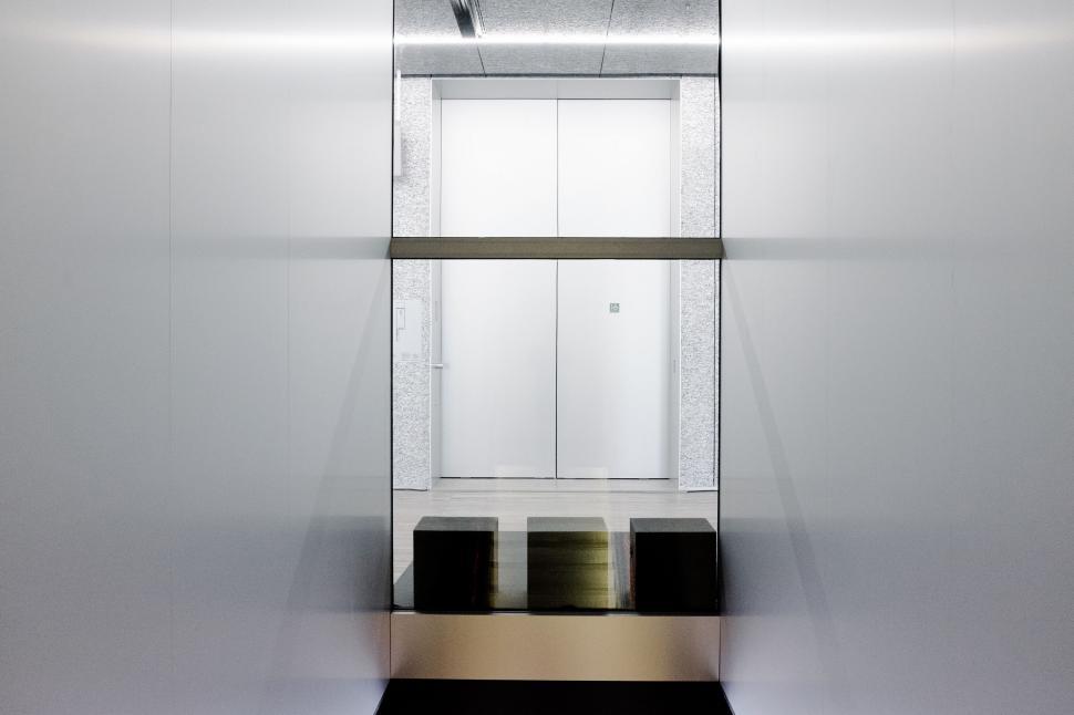 Free Image of Modern Bathroom With Mirror and Black and White Floor 