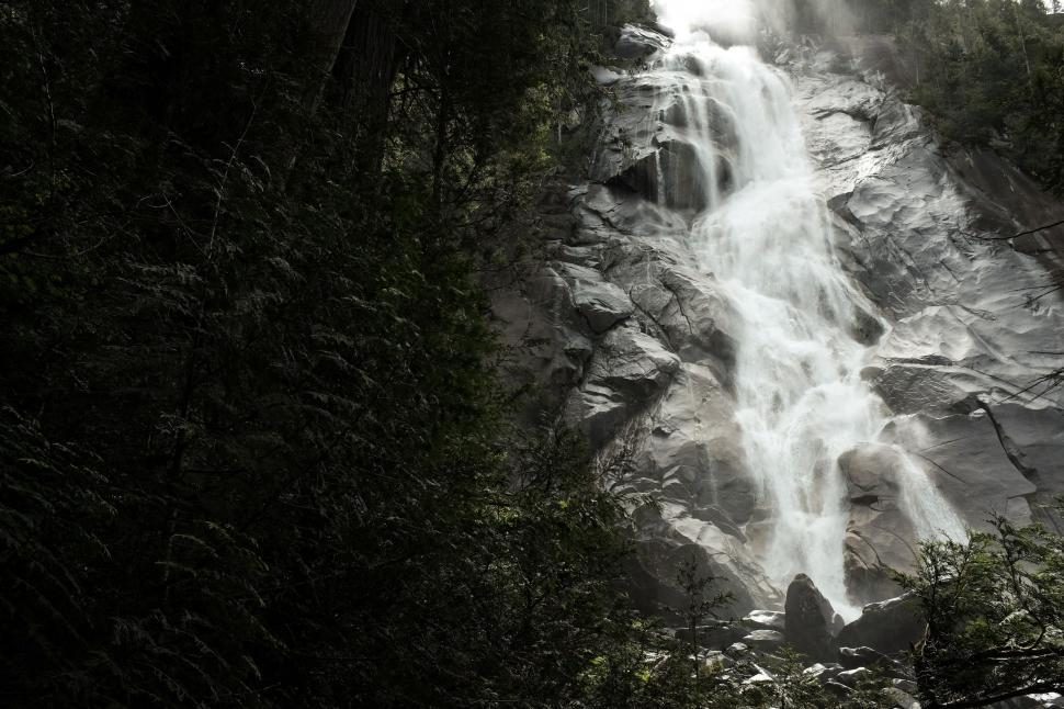 Free Image of Majestic Waterfall Cascading Down Rocks 