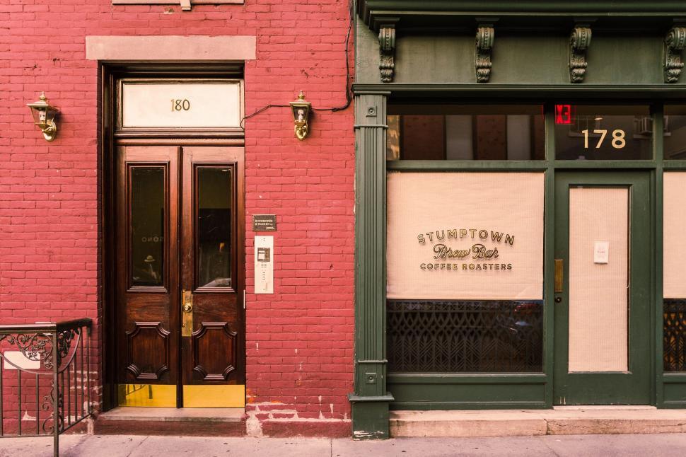 Free Image of Red Brick Building With Green Door 