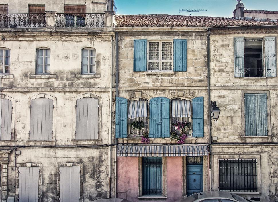 Free Image of Painting of a Building With Blue Shutters 
