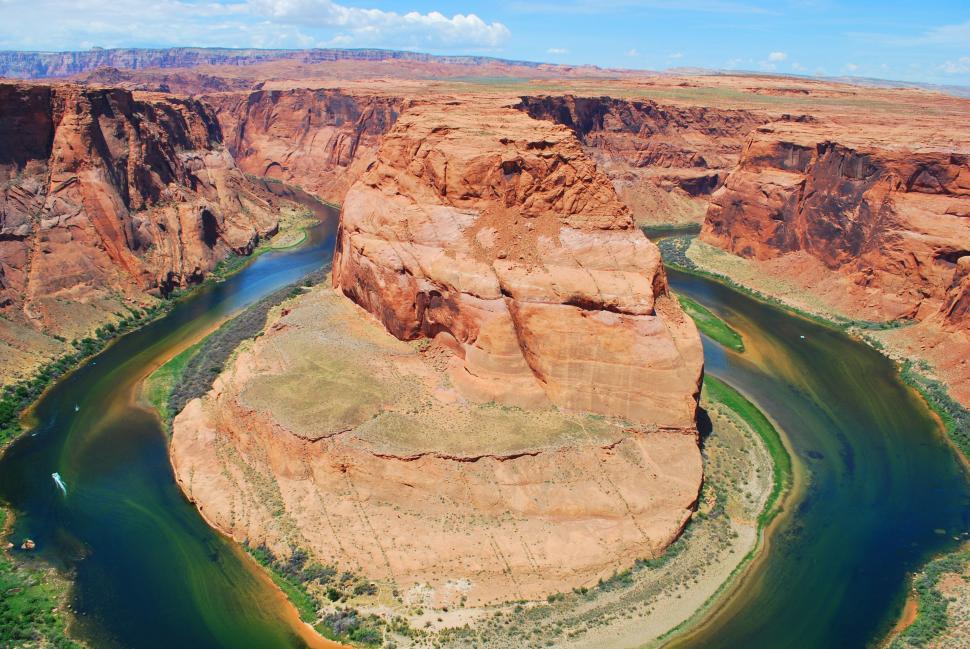 Free Image of River Flowing Through Canyon Surrounded by Mountains 