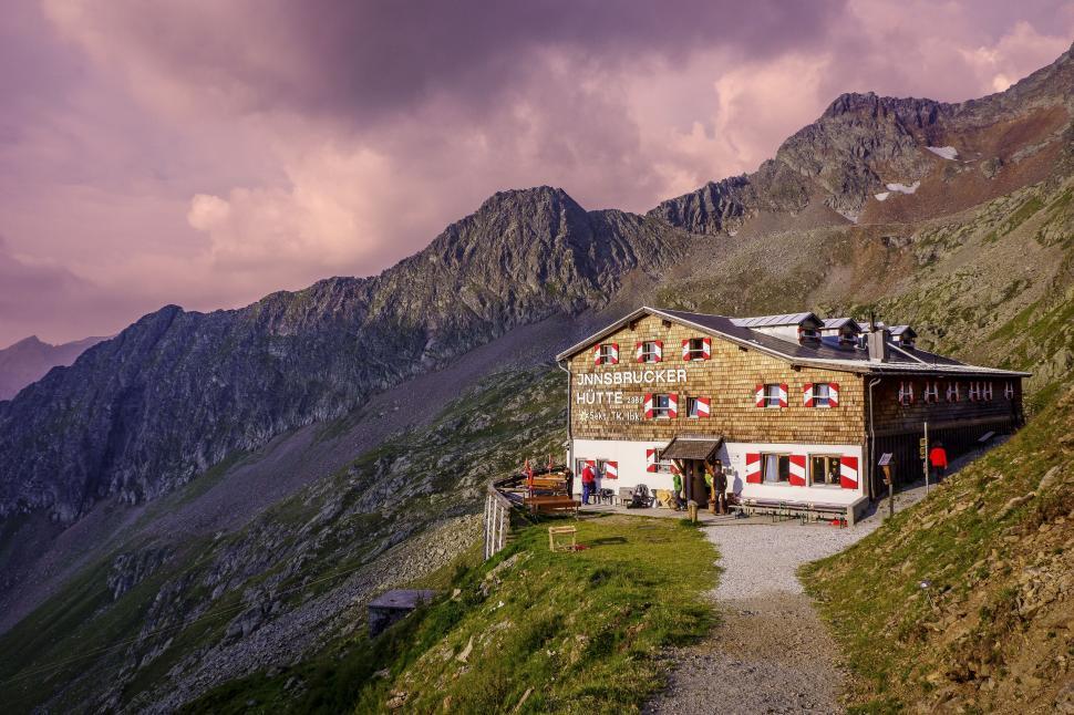 Free Image of Building Perched on Mountain With Mountain Background 