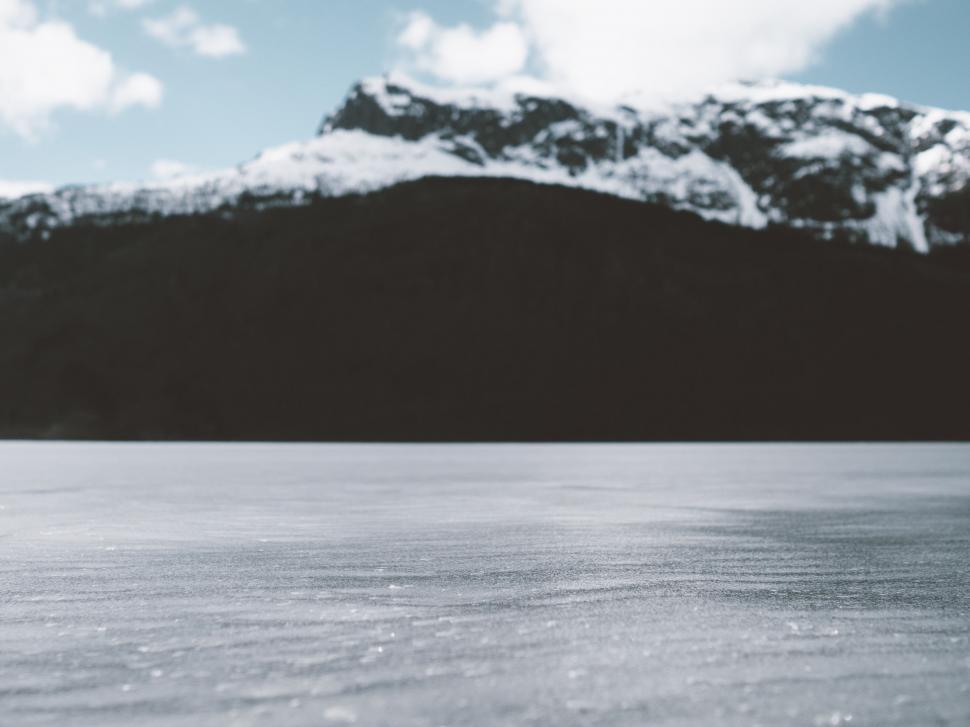 Free Image of Snowboarder Descending Snowy Hill 