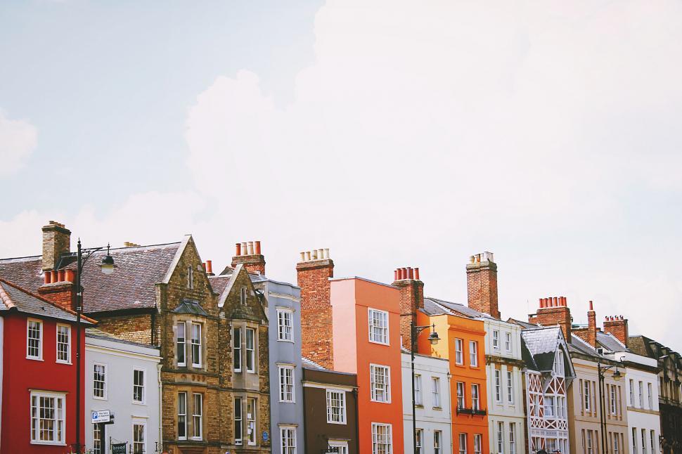 Free Image of Row of Buildings Under Sky Background 