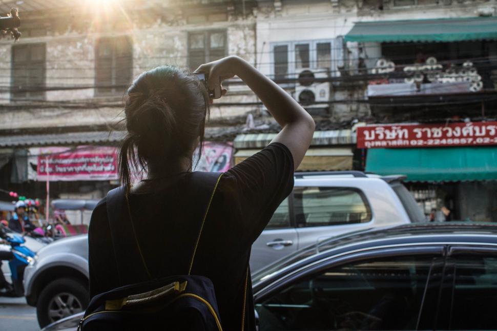 Free Image of Woman Standing on Side of Road 