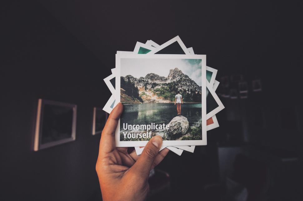 Free Image of Person Holding Up Picture of Lake 