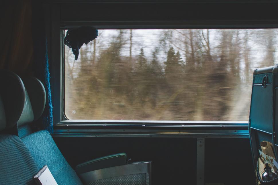 Free Image of Blue Chair in Front of Window 