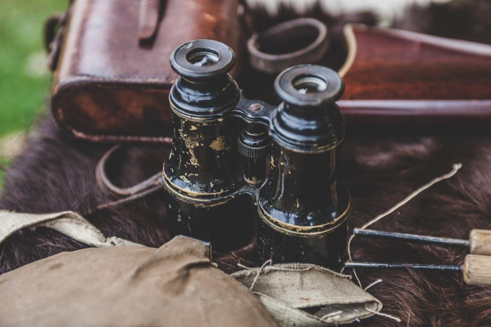 Free Image of Binoculars Resting on a Furry Animal 
