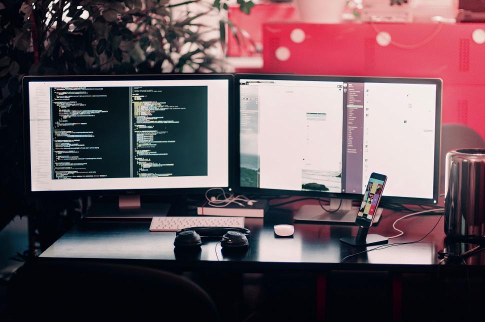 Free Image of Modern Computer Desk Setup With Double Monitors and Smartphone 