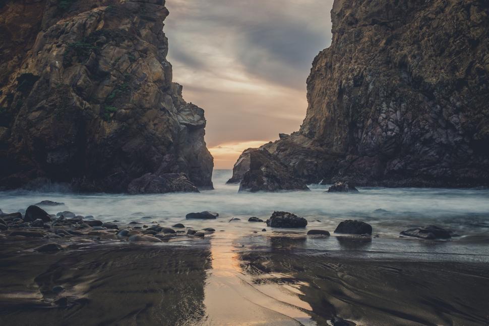 Free Image of Large Rocks Resting on Beach 