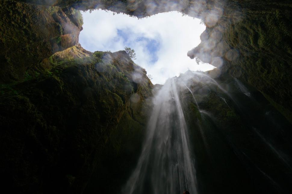 Free Image of Man Standing in the Middle of a Cave 