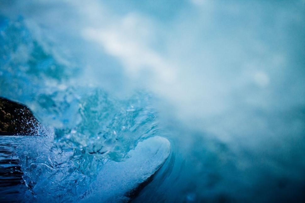 Free Image of Man Riding Wave on Surfboard 