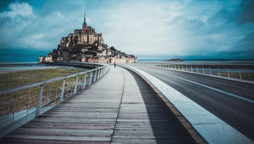 Free Image of Wooden Walkway Leading to Island in Ocean 