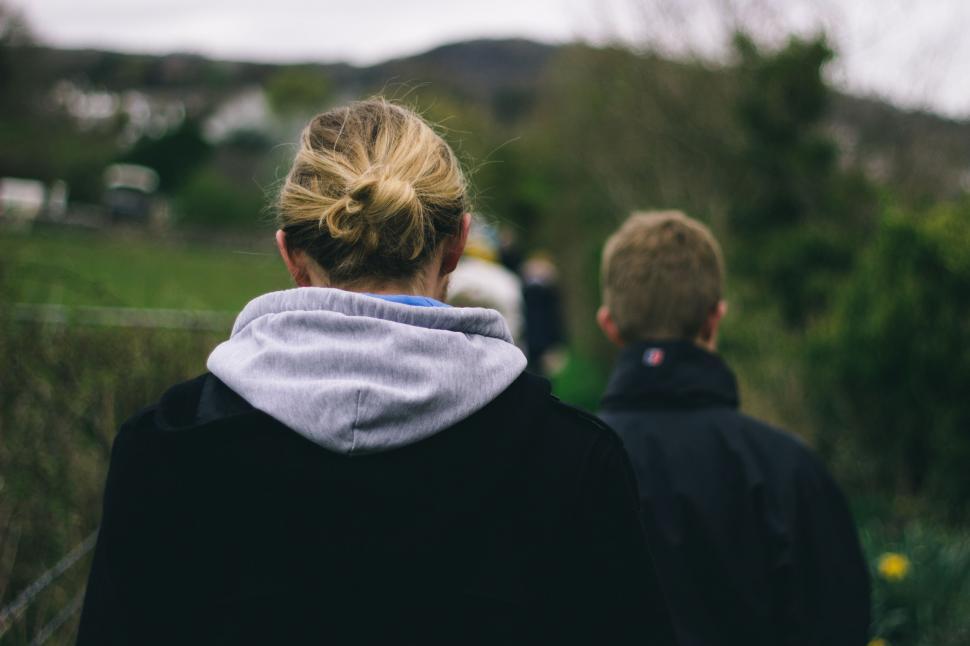 Free Image of Couple Walking in Grass 