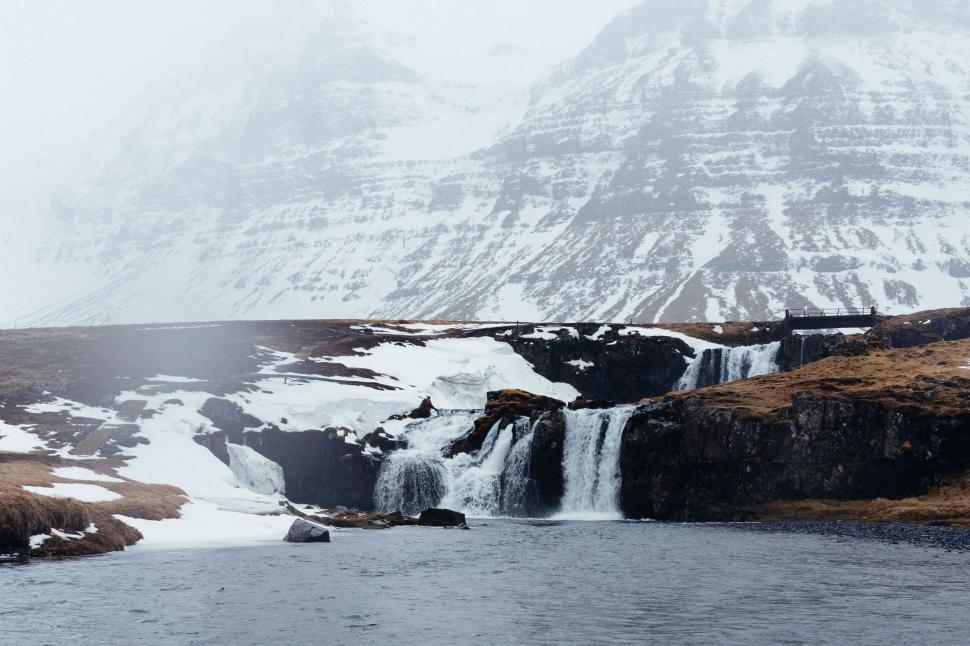 Free Image of Snow Covered Mountain With Waterfall 