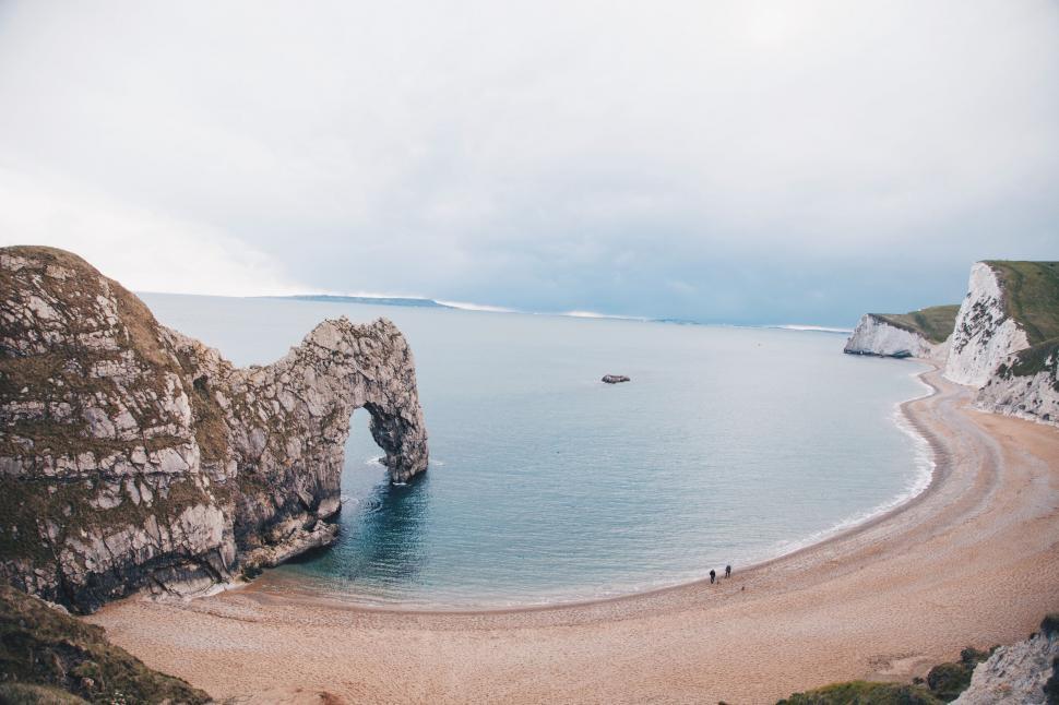 Free Image of Beach With Rock Formation 