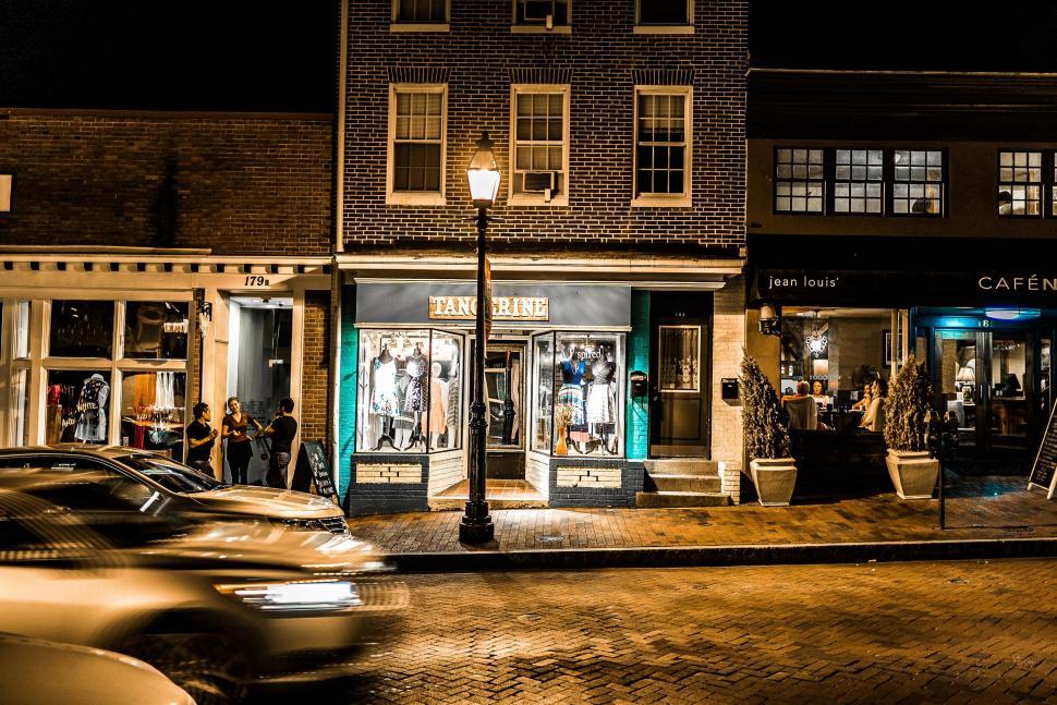 Free Image of City Street at Night With Cars Passing By 