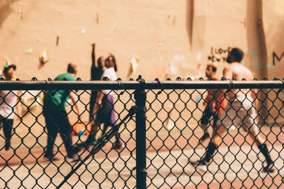 Free Image of Young Men Playing a Game of Basketball 