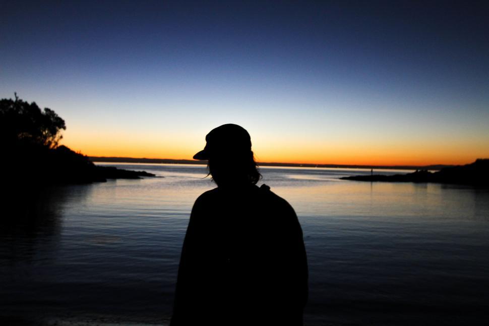 Free Image of Person Standing by Body of Water 