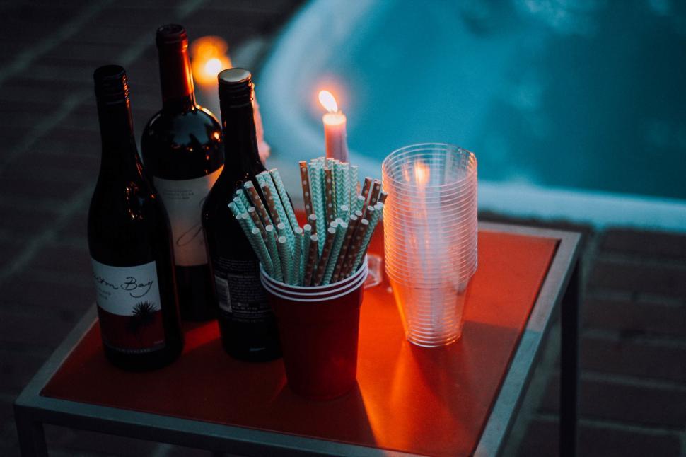 Free Image of Table Set With Wine Bottles and Candles 