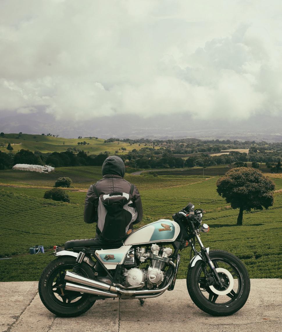 Free Image of Person Sitting on Motorcycle on Road 