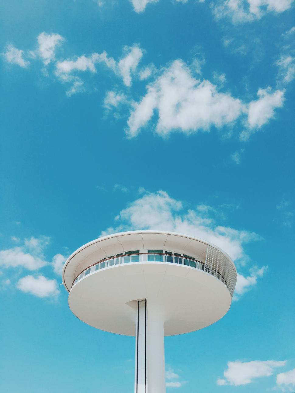 Free Image of Tall White Tower Against Sky 