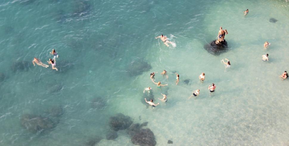 Free Image of Group of People Swimming in the Ocean 