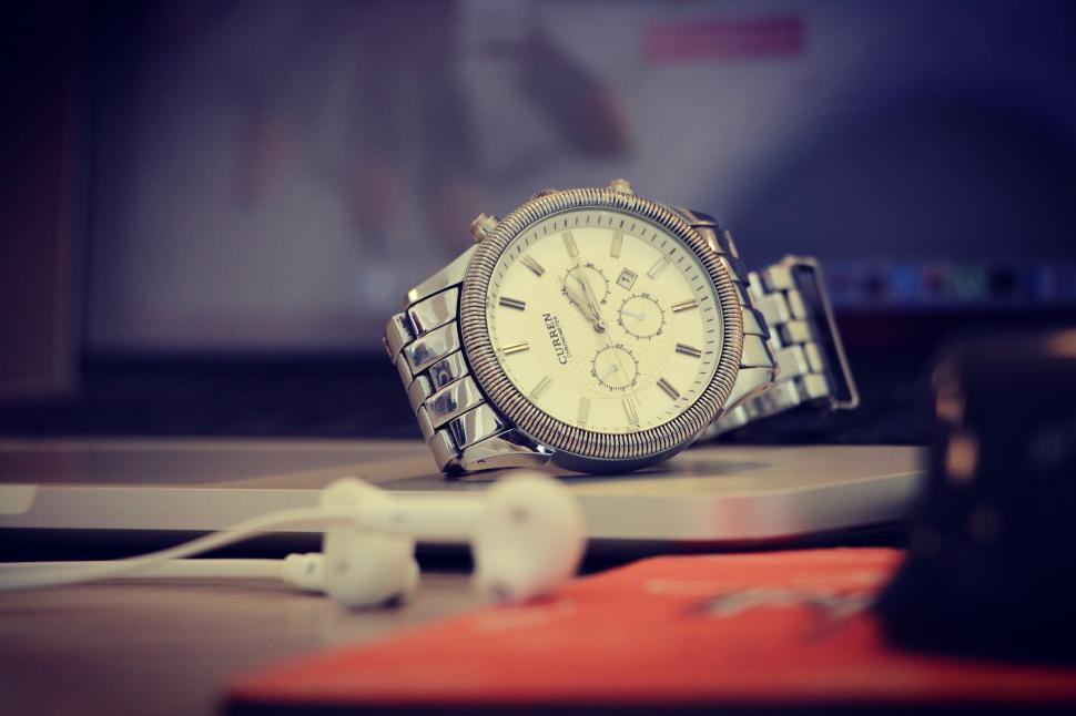 Free Image of Watch and Headphones on Table 